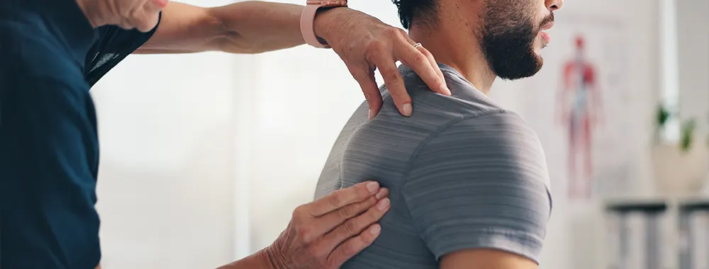 Chiropractor back massage and hands on patient