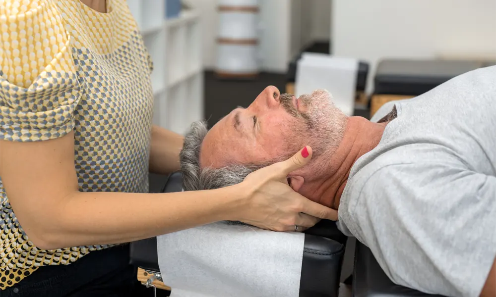 Senior Man Having Chiropractic Adjustment