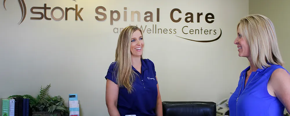 Chiropractor checking woman's posture
