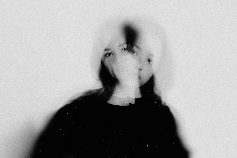 Woman's abstract portrait exploring themes of identity, struggle, and double exposure