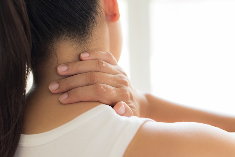 Closeup woman neck and shoulder pain and injury. Health care and medical concept. siam.pukkato@gmail.com