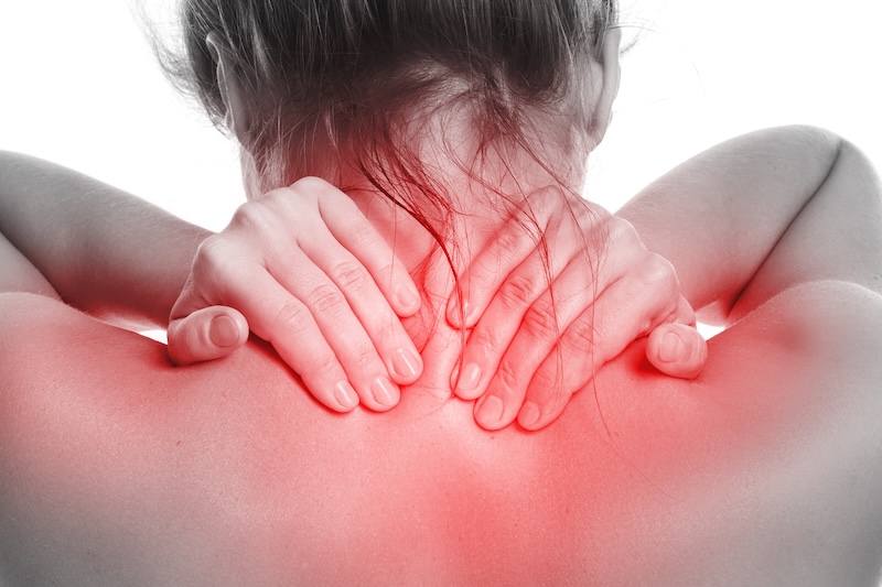 Woman with pain in her back and neck on white background